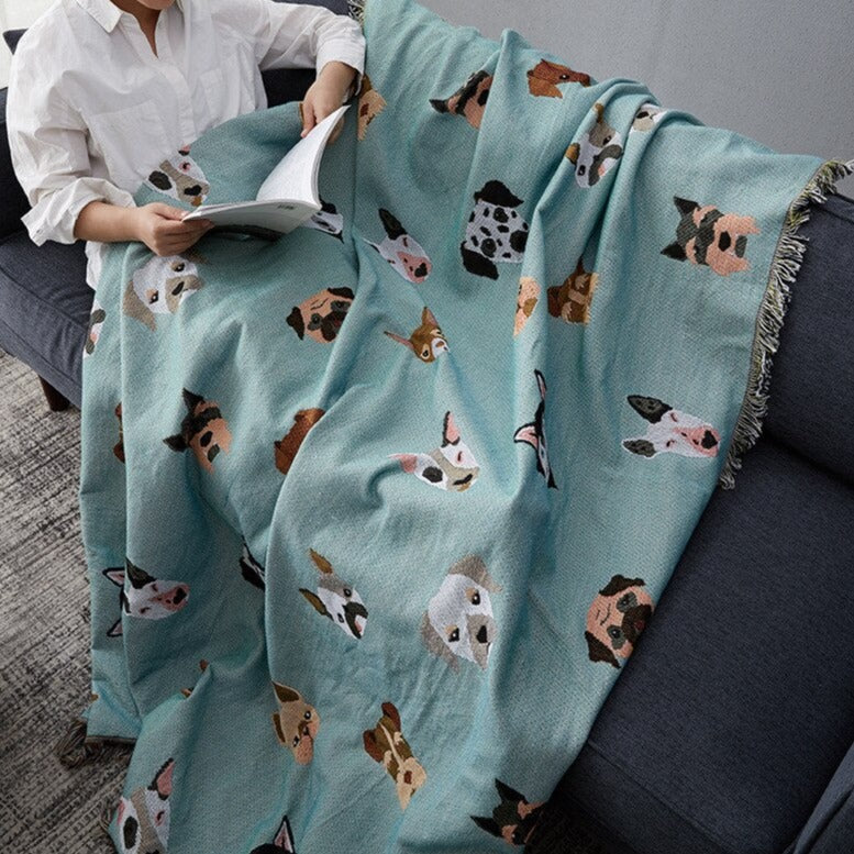 Mint green throw blanket with different dogs