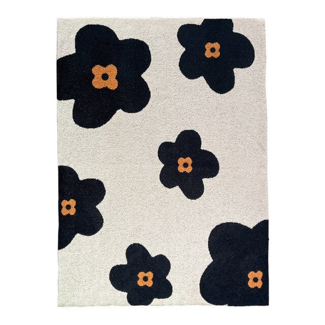 Soft knitted blanket cream with large black and amber flowers