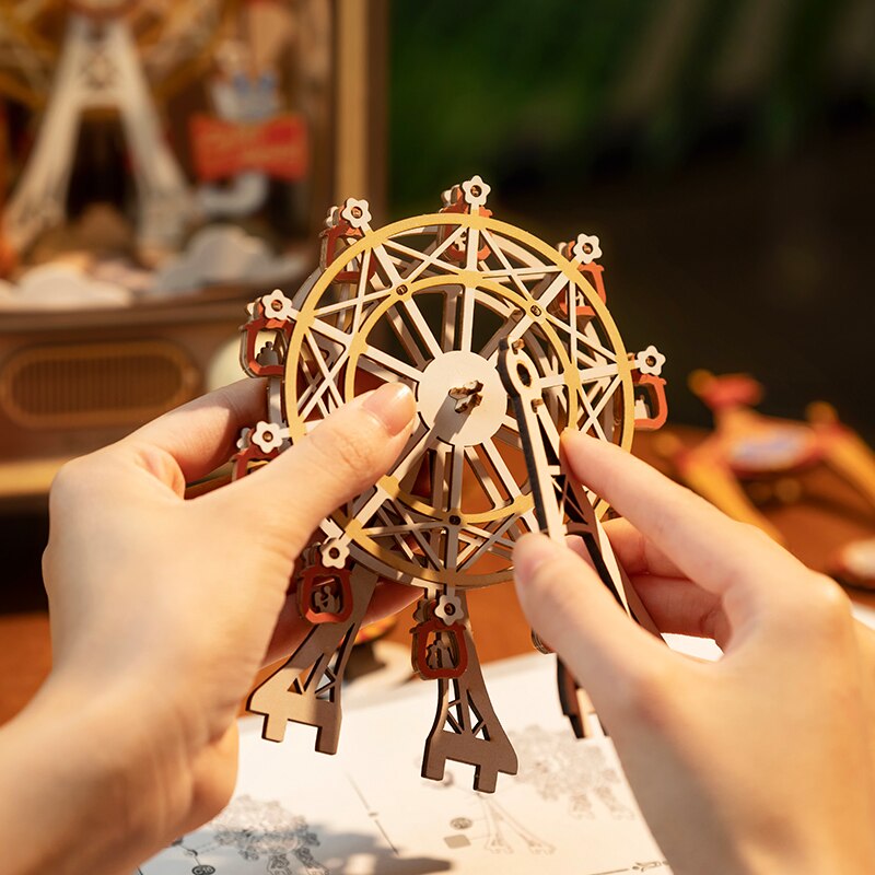 Person putting ferris wheel together