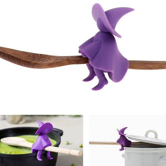 Purple kitchen witch on wooden spoon pot pan