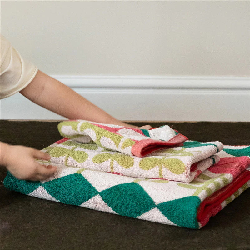 Folded towels modern flowers green pink