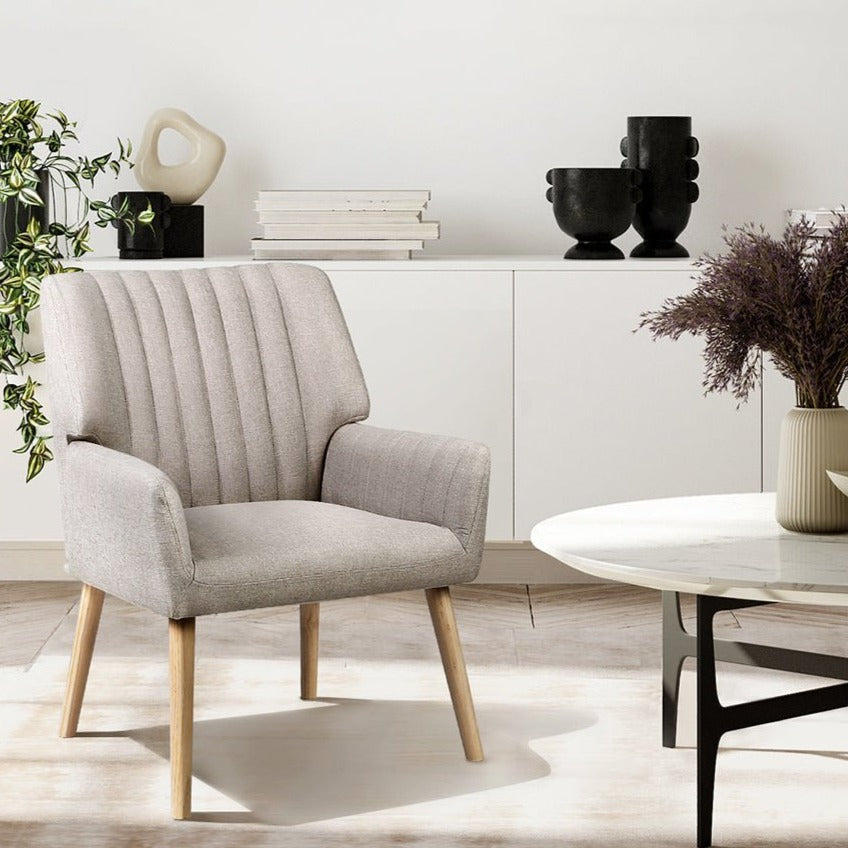 Beige upholstered armchair with wooden legs