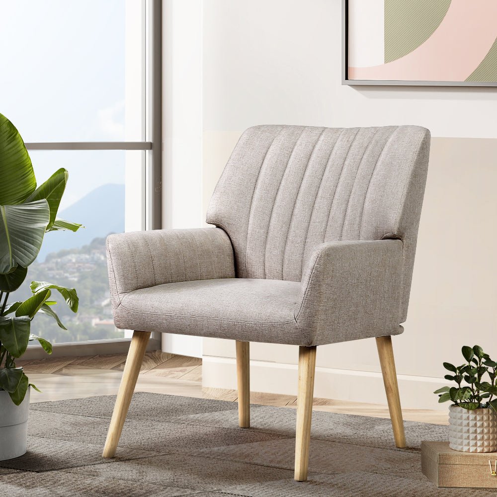 Beige upholstered armchair with wooden legs