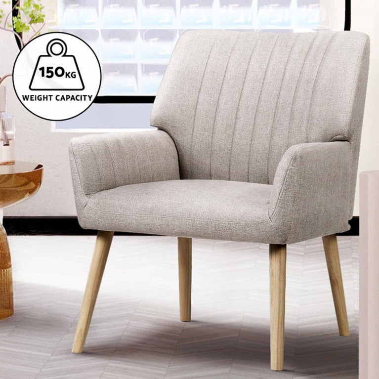 Beige upholstered armchair with wooden legs with notation