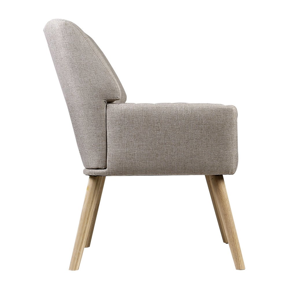 Beige upholstered armchair with wooden legs