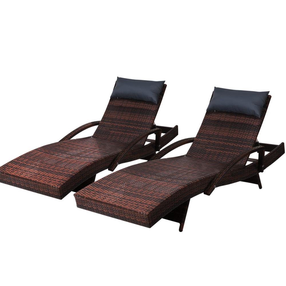 Brown adjustable wicker sun lounges with all-weather pillows